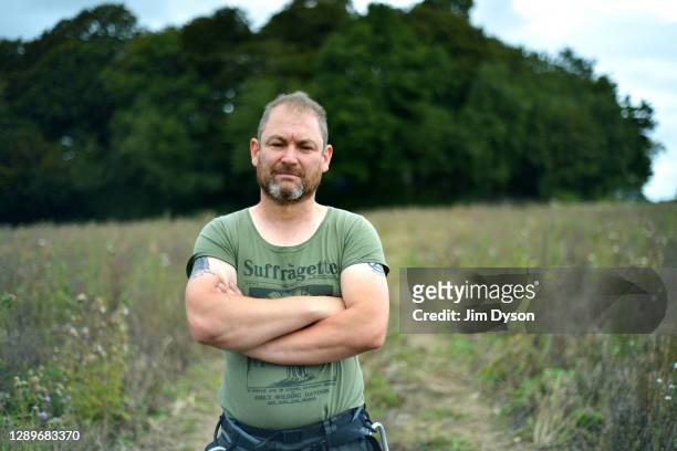 Environmental activist, Steve Masters, poses for a portrait in Jones Hill Wood at a protest camp against the HS2 High Speed Rail line and its...