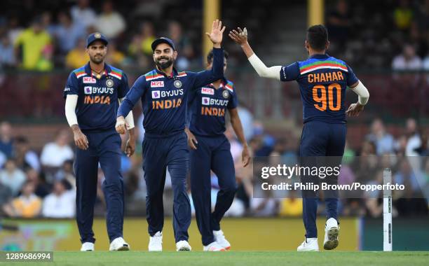 India's Virat Kohli celebrates with Deepak Chahar after the dismissal of D'Arcy Short during game two of the Twenty20 International series between...