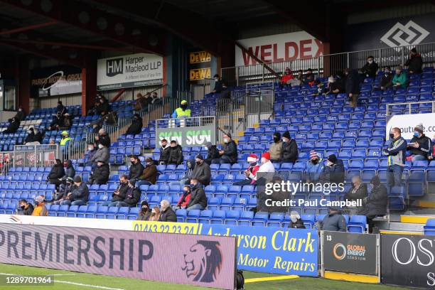 Ross County fans are seen wearing santa hats socially distanced in the stands prior to the Ladbrokes Scottish Premiership match between Ross County...