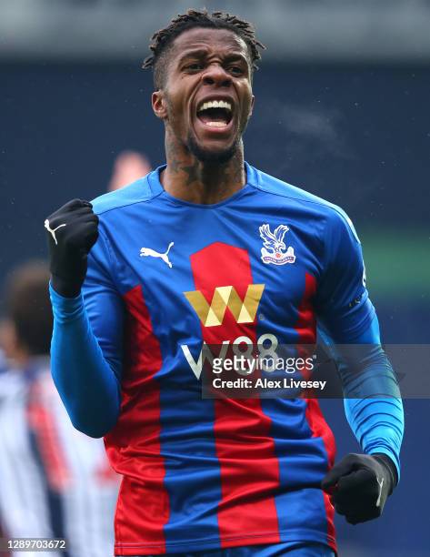 Wilfried Zaha of Crystal Palace celebrates after crossing the ball forcing Darnell Furlong of West Bromwich Albion to put the ball into his own net...
