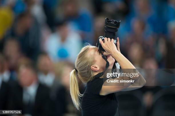 close-up of sports photographer - sports photographer stock pictures, royalty-free photos & images