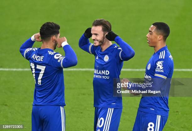 Ayoze Perez of Leicester City celebrates with team mates James Maddison and Youri Tielemans after scoring their sides first goal during the Premier...