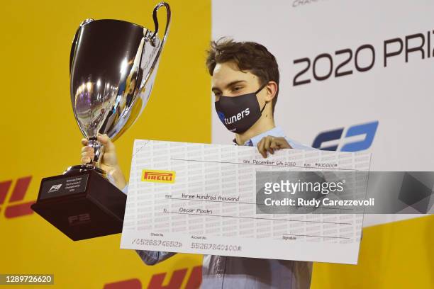 Champion Oscar Piastri of Australia and Prema Racing is presented with his trophy during the Formula 3 Championship Prize Giving Ceremony at Bahrain...