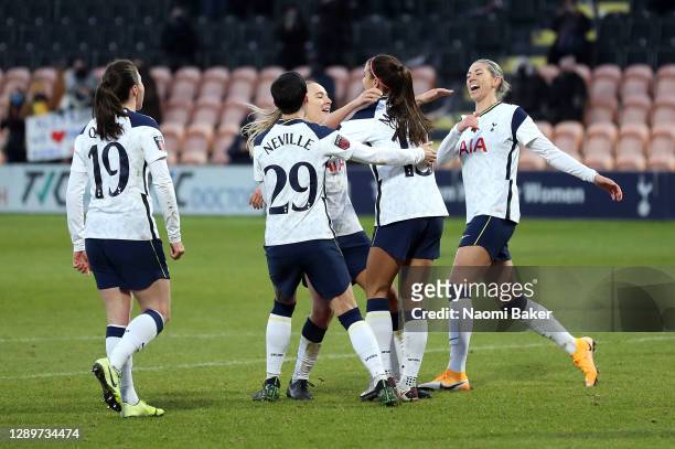 Alex Morgan of Tottenham Hotspur celebrates with teammates after scoring her team's third goal during the Barclays FA Women's Super League match...