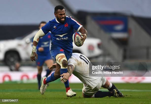 Alivereti Raka of France is tackled by Joe Marler of England during the Autumn Nations Cup Final & Quilter International between England and France...