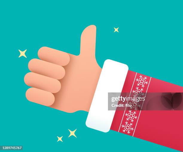 santa holiday thumbs up hand - christmas sweater stock illustrations