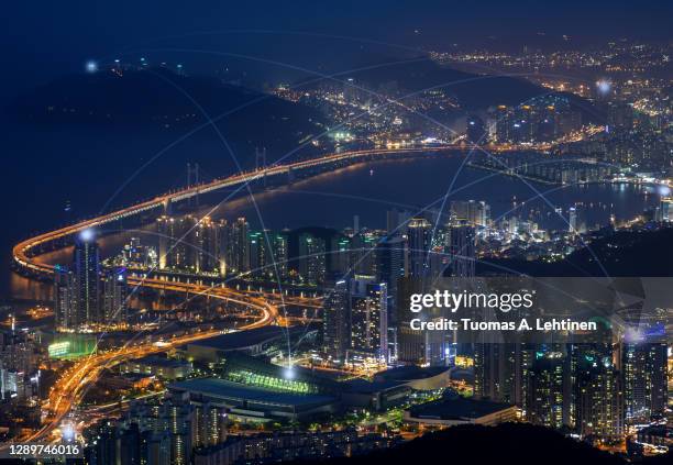 smart city and connection lines. cityscape of busan, south korea, at night. - busan fotografías e imágenes de stock