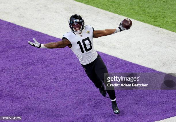 Laviska Shenault Jr. #10 of the Jacksonville Jaguars celebrates his touchdown in the first quarter against the Minnesota Vikings at U.S. Bank Stadium...