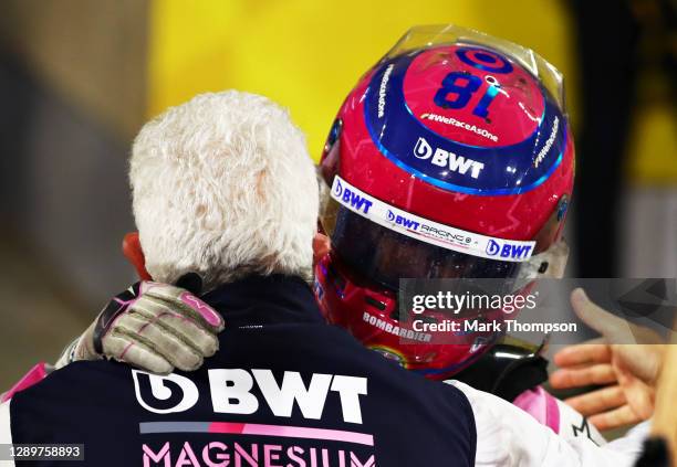 Third placed Lance Stroll of Canada and Racing Point celebrates with his father, Owner of Racing Point Lawrence Stroll in parc ferme during the F1...