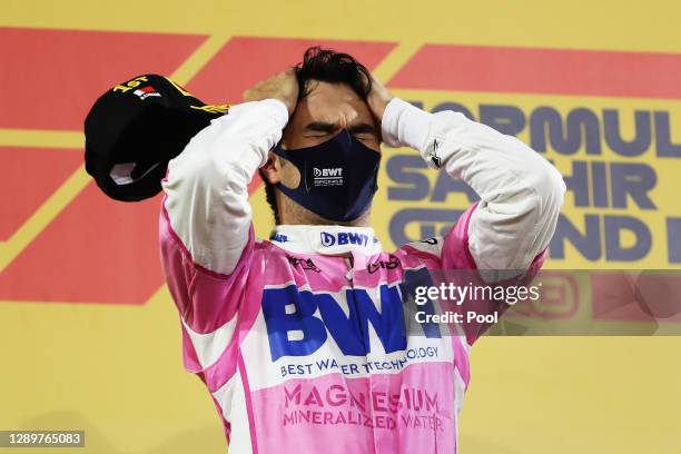 Race winner Sergio Perez of Mexico and Racing Point celebrates his maiden F1 victory on the podium during the F1 Grand Prix of Sakhir at Bahrain...