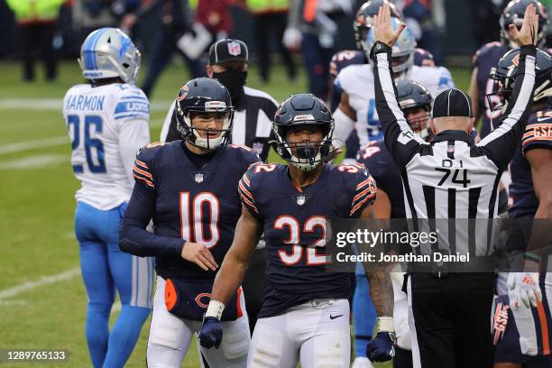 David Montgomery of the Chicago Bears is congratulated by Mitchell Trubisky after scoring a four-yard rushing touchdown against the Detroit Lions...