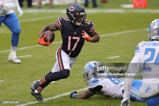 Anthony Miller of the Chicago Bears runs the ball against Jamie Collins Sr. #58 of the Detroit Lions during the first half at Soldier Field on...