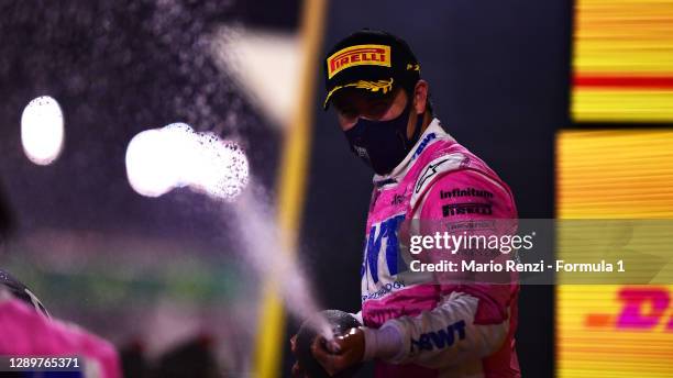 Race winner Sergio Perez of Mexico and Racing Point celebrates his maiden F1 victory on the podium during the F1 Grand Prix of Sakhir at Bahrain...