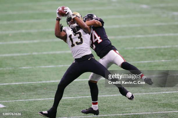 Michael Thomas of the New Orleans Saints makes the third quarter reception against A.J. Terrell of the Atlanta Falcons at Mercedes-Benz Stadium on...