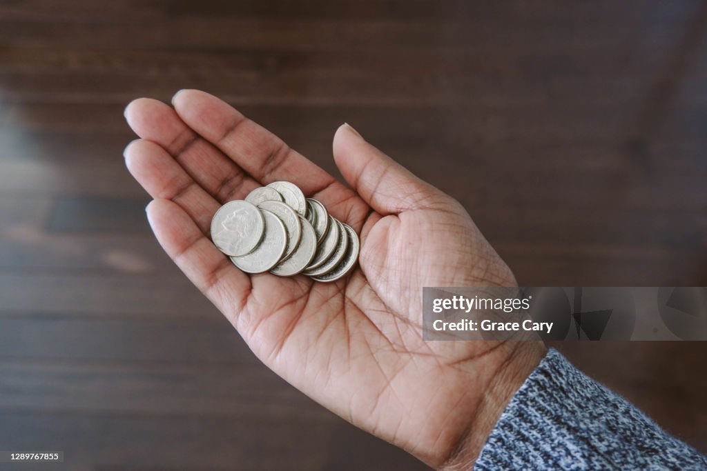 Hand Making Change Woman Holds Change In Palm Of Hand High-Res Stock Photo - Getty Images