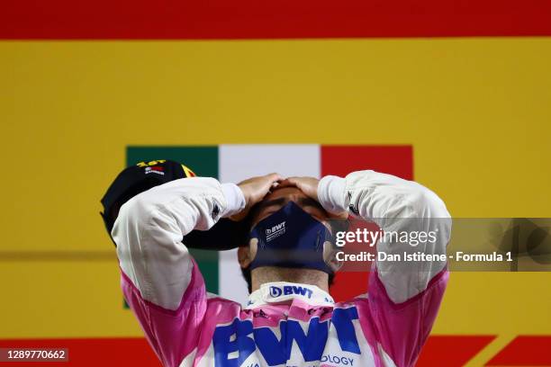 Race winner Sergio Perez of Mexico and Racing Point celebrates his maiden F1 victory on the podium during the F1 Grand Prix of Sakhir at Bahrain...