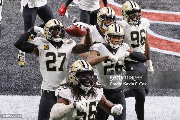 The New Orleans Saints celebrate a coaches challenge against the Atlanta Falcons during the fourth quarter at Mercedes-Benz Stadium on December 06,...