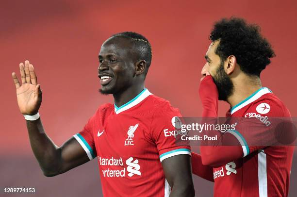 Sadio Mane of Liverpool celebrates with team mate Mohamed Salah after an own goal from Nelson Semedo of Wolverhampton Wanderers during the Premier...