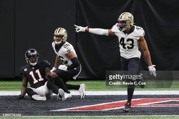 Marcus Williams of the New Orleans Saints celebrates breaking up a pass to Julio Jones of the Atlanta Falcons in the closing minutes of their game at...