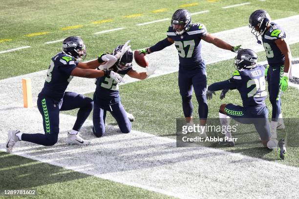 Quandre Diggs of the Seattle Seahawks celebrates his interception against the New York Giants during the first quarter in the game at Lumen Field on...