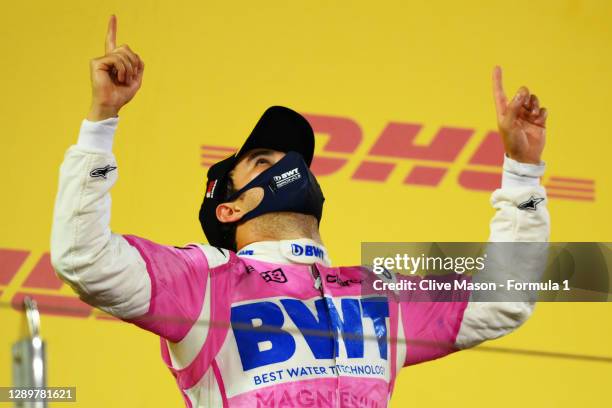 Race winner Sergio Perez of Mexico and Racing Point celebrates his maiden F1 victory on the podium during the F1 Grand Prix of Sakhir at Bahrain...