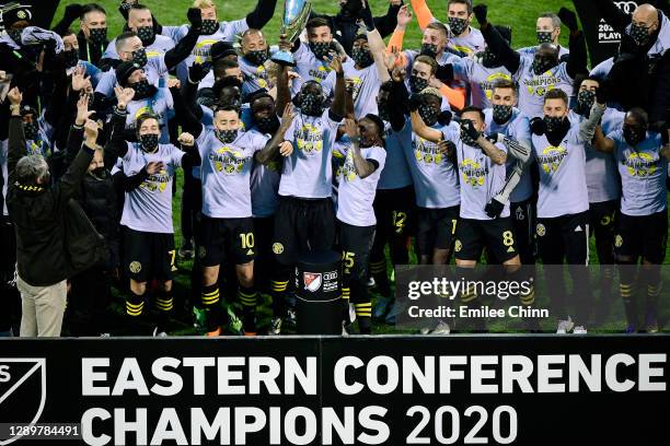 Columbus Crew captain Jonathan Mensah holds up the Eastern Conference trophy after their 1-0 win over the New England Revolution during the Eastern...