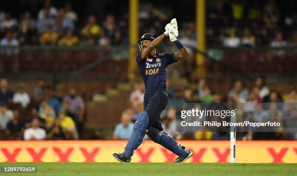 Hardik Pandya of India hits a six to win the match in game two of the Twenty20 International series between Australia and India at Sydney Cricket...