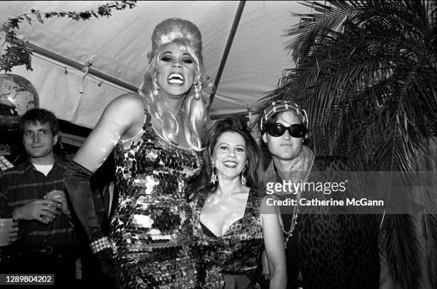 RuPaul poses for a photo with Kate Pierson and Keith Strickland of the B-52s at a party in July 1992 in New York City, New York.