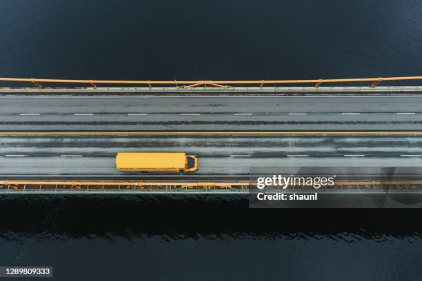 school bus crossing bridge - bus road stock pictures, royalty-free photos & images