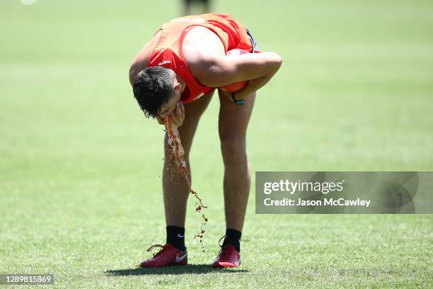 Barry O'Connor vomits during a Sydney Swans AFL training session at Lakeside Oval on December 07, 2020 in Sydney, Australia.