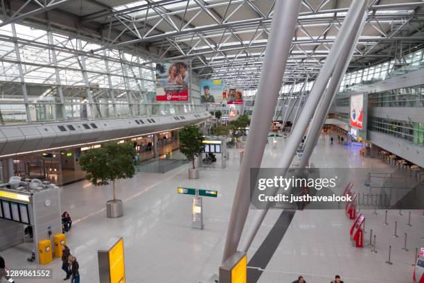 high angle view into departure hall of airport duesseldorf - airport düsseldorf stock pictures, royalty-free photos & images