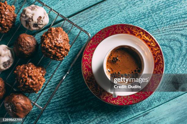 turkish coffee on wooden table with flower and chocolate background - turkish delight stock pictures, royalty-free photos & images