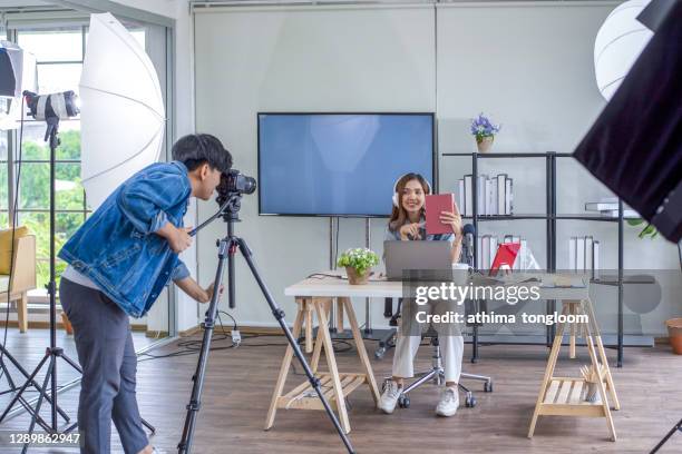 two blogger review in front of the camera to recording vlog video live streaming at home.business online influencer on social media concept - live event business stock pictures, royalty-free photos & images