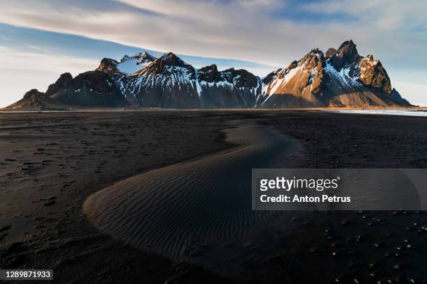 sunset at vestrahorn mountain and stokksnes beach. iceland - volcanic landscape stock pictures, royalty-free photos & images