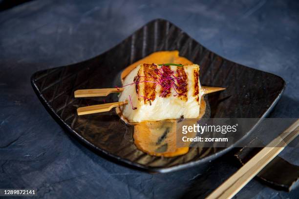 sea bass fillet on miso barbeque sauce in plate - miso sauce stock pictures, royalty-free photos & images