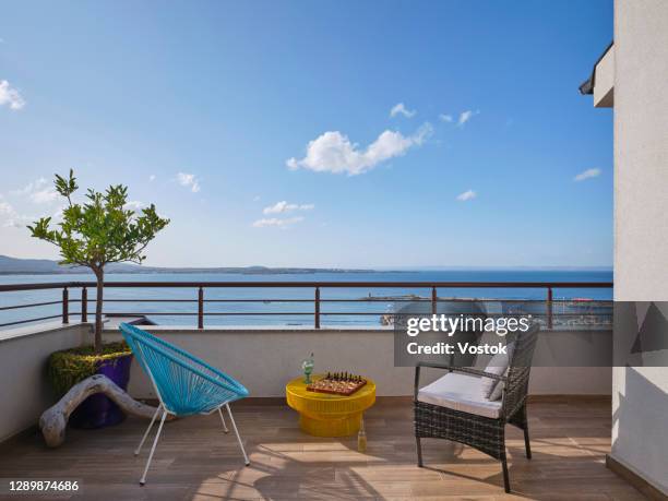 summer terrace with sea view - balcony view stockfoto's en -beelden