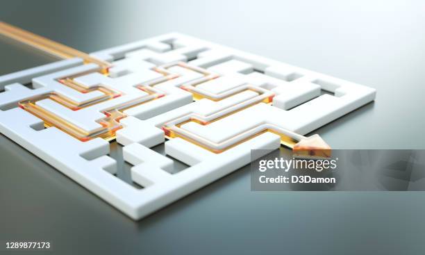 orange path across a white maze. finding solutions concept - maze solution stock pictures, royalty-free photos & images