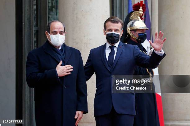 French President Emmanuel Macron welcomes Egyptian President Abdel Fattah al-Sisi prior to their meeting at the Elysee Presidential Palace on...