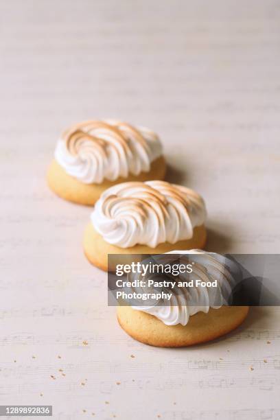 lemon cookies with italian meringue - burnt cookies stock pictures, royalty-free photos & images