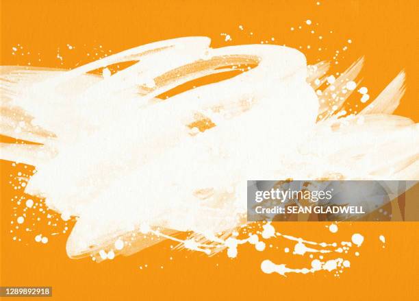 white paint on orange - paint textures ストックフォトと画像