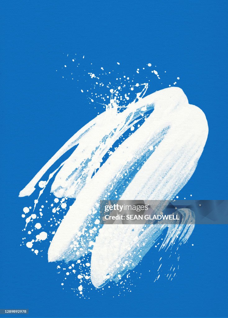 White paint splash on blue