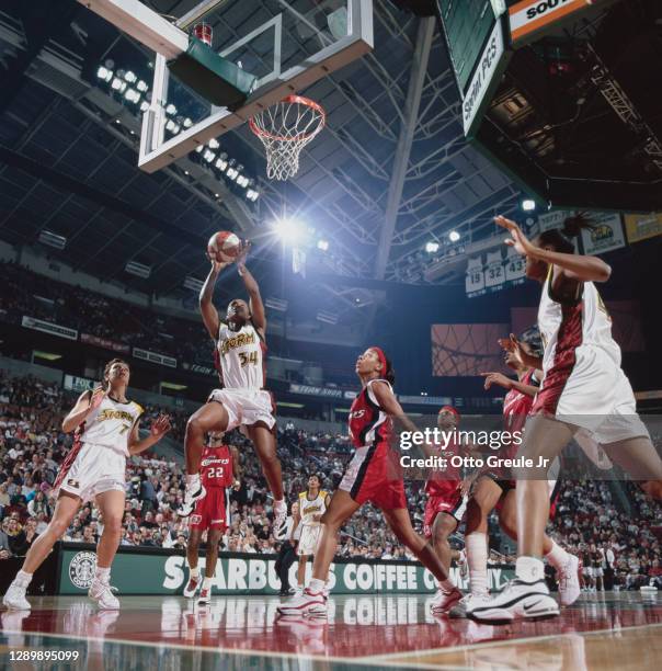 Sonja Henning, Guard for the Seattle Storm drives to the basket to make a jump shot during the WNBA Western Conference basketball game against the...