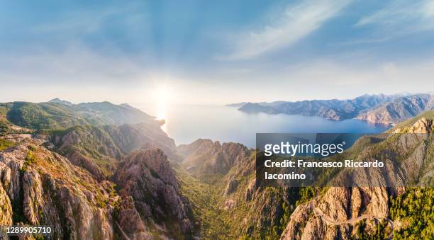 panoramic aerial view of calanches de piana coastline, western corsica island, france, a unesco heritage site - corsica france stock pictures, royalty-free photos & images