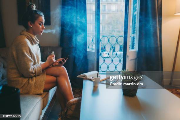 woman staying home during covid-19 pandemic - staying indoors stock pictures, royalty-free photos & images