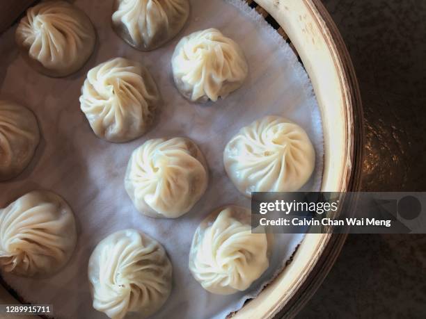 chinese xiao long bao or steamed dumplings - singapore food stock pictures, royalty-free photos & images