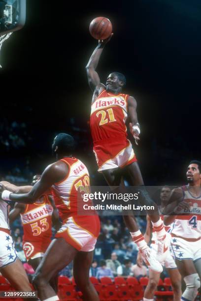 Dominique Wilkins of the Atlanta Hawks drives to the basket during a NBA basketball game against the Washington Bullets at the Capital Centre on...