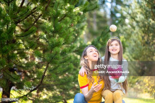 family playing outside in their backyard - backyard baseball stock pictures, royalty-free photos & images