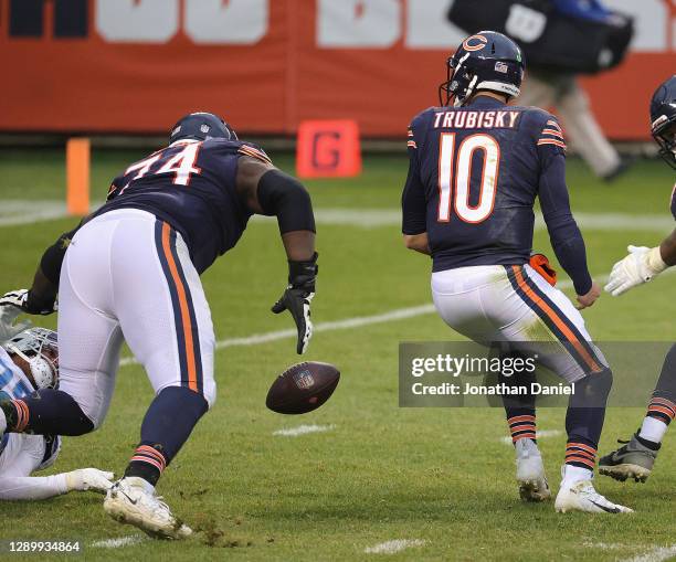 Germain Ifedi and Mitchell Trubisky of the Chicago Bears try to recover a fumble by Trubisky late in the game against the Detroit Lions at Soldier...