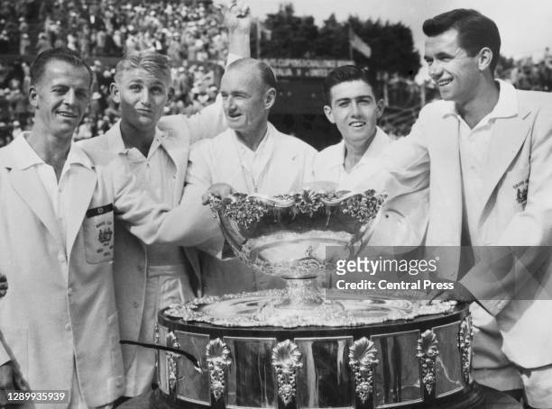 Rex Hartwig, Lew Hoad, team captain Harry Hopman, Ken Rosewall and Mervyn Rose celebrate after being presented with the Davis Cup after defeating the...