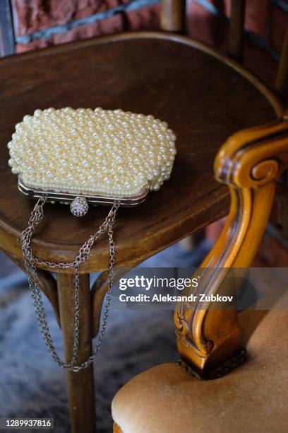 women's bag made of beads, beads and rhinestones. elegant fashionable stylish bride's purse with a metal chain. - beads stock-fotos und bilder